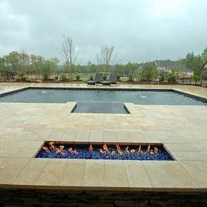 105. Fire feature, travertine patio, and deck level spa