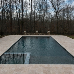 128. Rectangle 20'x40' pool with deck level spa and travertine patio